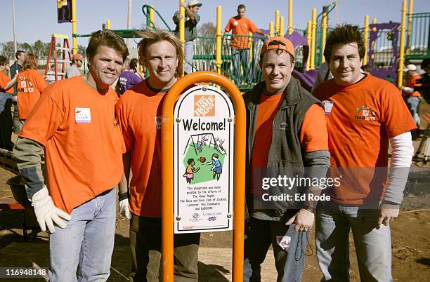 Richie McDonald, Keech Rainwater, Dean Sams, Michael Britt, pose in front of the playground they helped build.