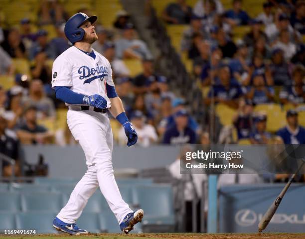 Max Muncy of the Los Angeles Dodgers reacts to his walk off solo homerun to beat the Toronto Blue Jays 2-1 during the 10th inning at Dodger Stadium...