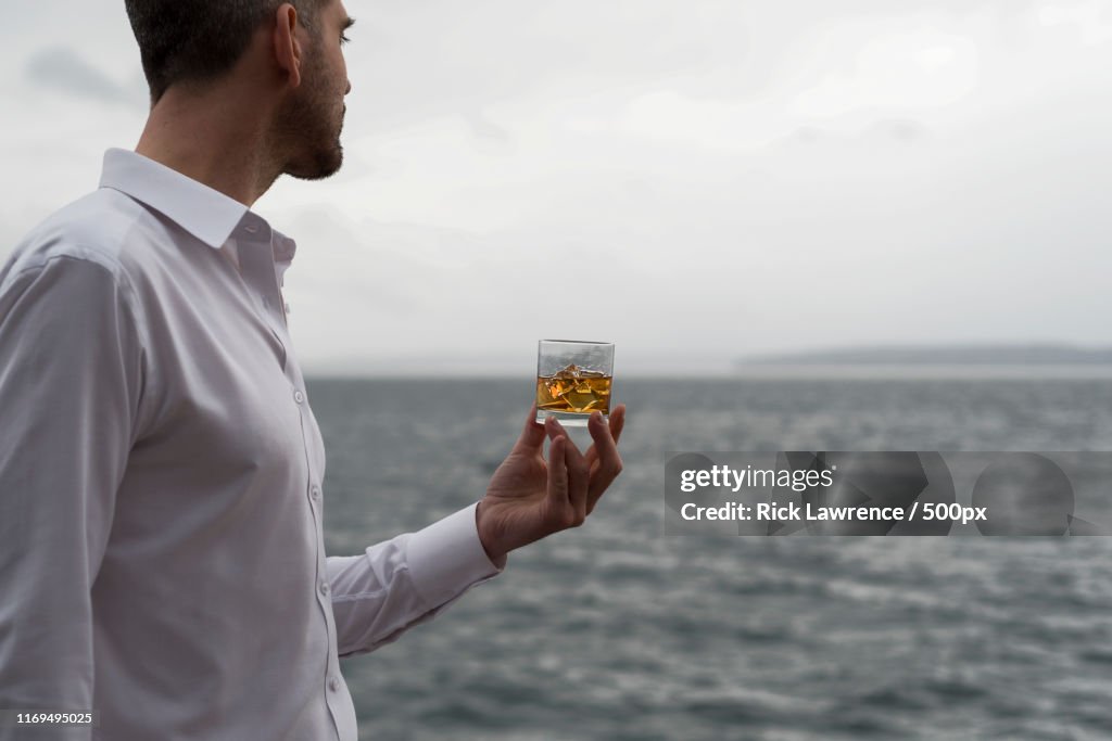 Contemplative Whiskey By The Sea