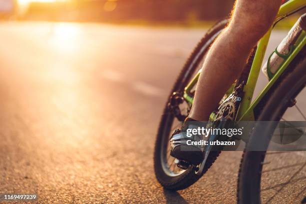road bike rider - human leg closeup stock pictures, royalty-free photos & images