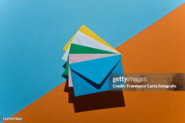 colored envelopes - carta documento stock pictures, royalty-free photos & images