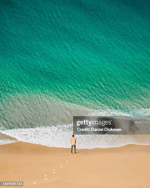 creative manipulation - wall of water (green) - one man only stock pictures, royalty-free photos & images