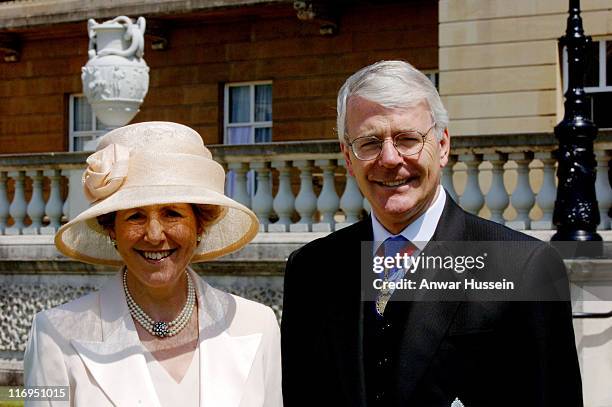 John Major and his wife Norma attend a lunch for Second World War Veterans in the gardens of Buckingham Palace on National Commemoration Day July 10,...