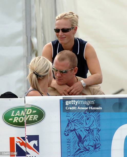 Zara Phillips, daughter of Princess Anne, puts her arms around boyfriend Mike Tindall on the third day of the Gatcombe Park Festival of British...