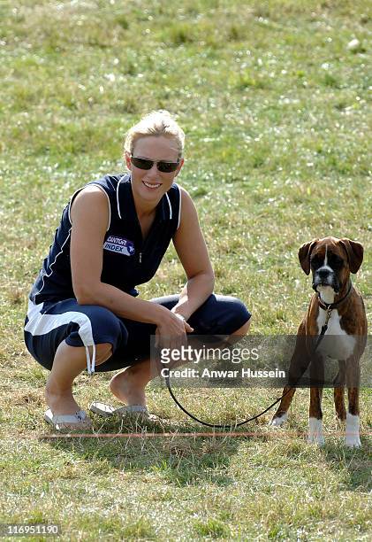 Zara Phillips, daughter of Princess Anne, plays with her pet dog on the third day of the Gatcombe Park Festival of British Eventing at Gatcombe Park,...