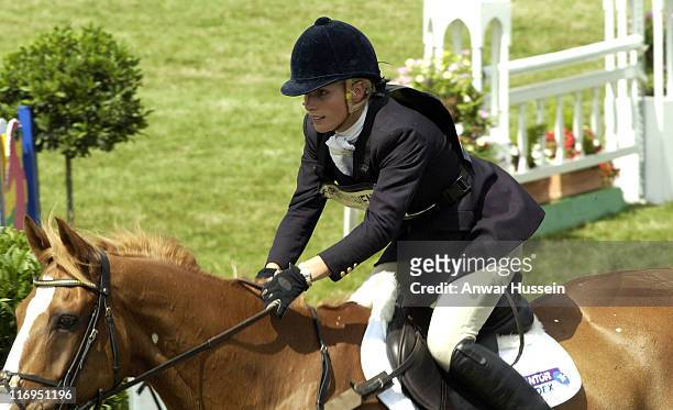 Zara Phillips, daughter of Princess Anne, competes in the showjumping section on the third day of the Gatcombe Park Festival of British Eventing at...