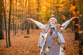 young woman enjoying autumn
