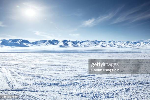 snow mountain and lake in winter - snowfield fotografías e imágenes de stock
