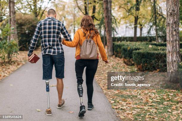 couple walking in park - stiga stock pictures, royalty-free photos & images