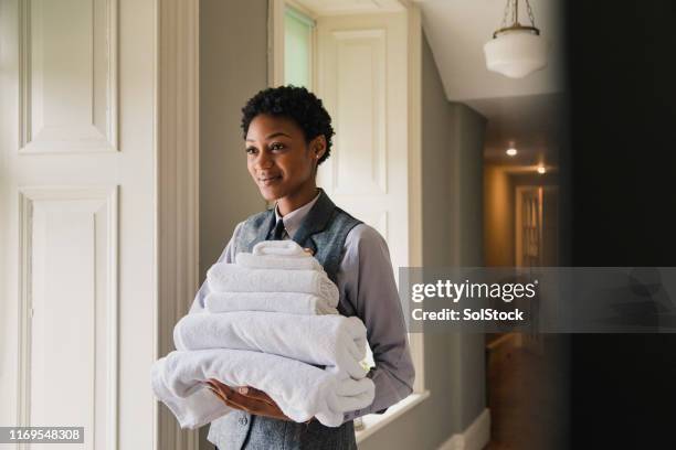 clean and fresh cotton towels - hotel staff stock pictures, royalty-free photos & images