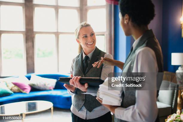 workers in a luxury hotel - waiter using digital tablet stock pictures, royalty-free photos & images