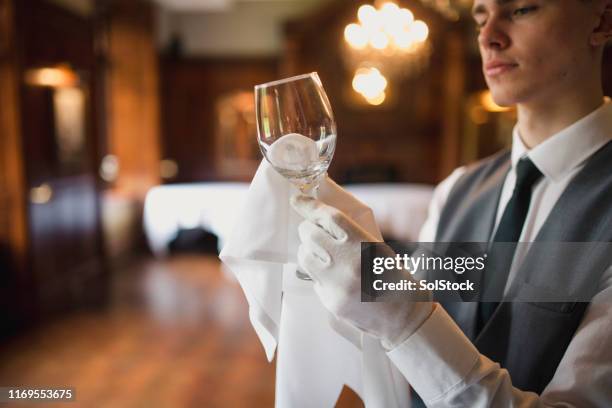 polishing glasses in a luxury restaurant - shiny glass stock pictures, royalty-free photos & images