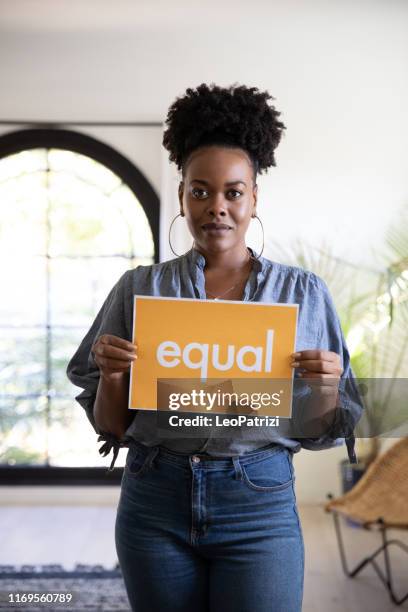 woman stands for equal rights - racism stock pictures, royalty-free photos & images