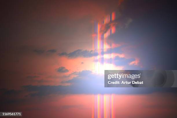 beautiful rainbow flare in the sunset sky with bright light. - rainbow clouds stock pictures, royalty-free photos & images