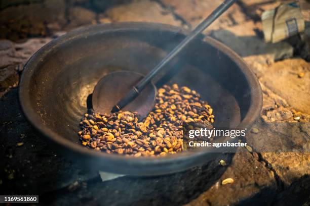 kopi luwak coffee beans in indonesian coffee roastery - sumatra stock pictures, royalty-free photos & images