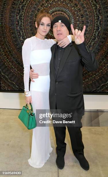 Sophie Cannell and Damien Hirst attend a private view of "Damien Hirst: Mandalas" at White Cube Gallery on September 19, 2019 in London, England.