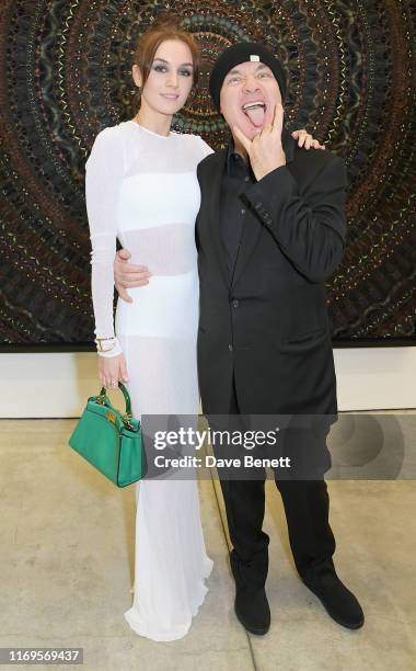 Sophie Cannell and Damien Hirst attend a private view of "Damien Hirst: Mandalas" at White Cube Gallery on September 19, 2019 in London, England.