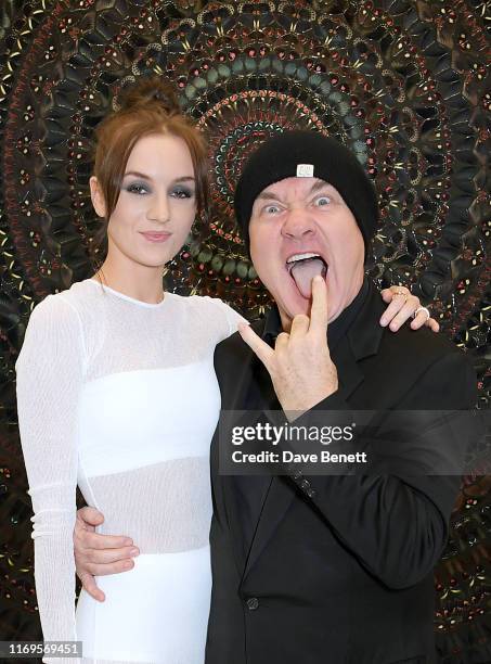 Sophie Cannell and Damien Hirst attend a private view of "Damien Hirst: Mandalas" at White Cube Gallery on September 19, 2019 in London, England.