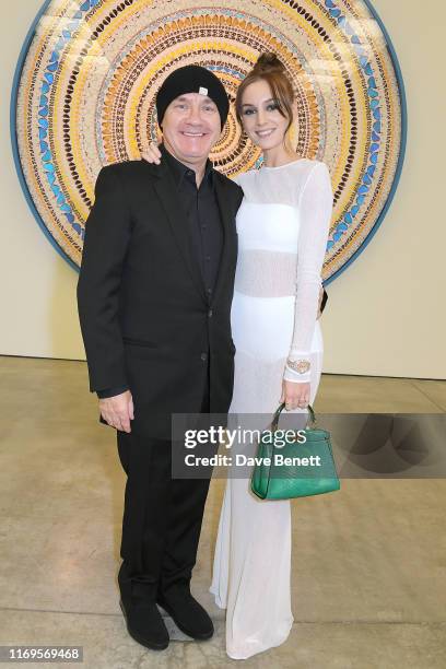 Damien Hirst and Sophie Cannell attend a private view of "Damien Hirst: Mandalas" at White Cube Gallery on September 19, 2019 in London, England.