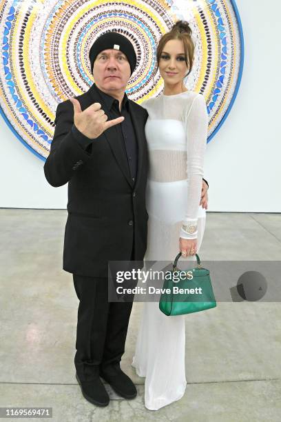 Damien Hirst and Sophie Cannell attend a private view of "Damien Hirst: Mandalas" at White Cube Gallery on September 19, 2019 in London, England.
