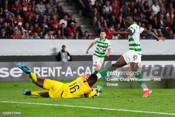 Celtic's Vakoun Issouf Bayo goes for the ball as Stade Rennais' Edouard Mendy spills a shot during the UEFA Europa League Group E match between Stade...