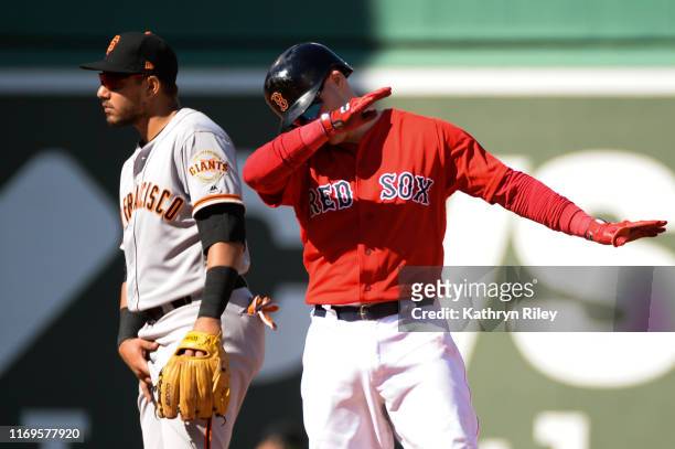 Brock Holt of the Boston Red Sox dabs after hitting a double in the fifth inning against the San Francisco Giants at Fenway Park on September 19,...