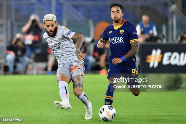 Istanbul Basaksehir FK's Brazilian defender Junior Caicara passes the ball despite AS Roma's Dutch forward Justin Kluivert during the UEFA Europa...