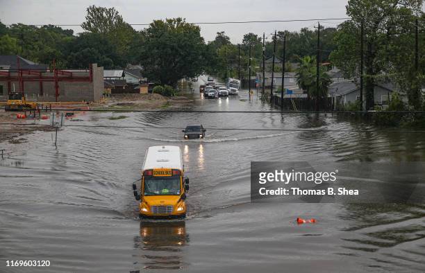 School bus makes its way on the flooded Hopper Rd. On September 19, 2019 in Houston, Texas. Gov. Greg Abbott has declared much of Southeast Texas...