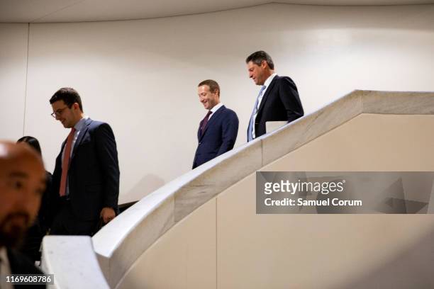 Facebook founder and CEO Mark Zuckerberg and Facebook's Vice President of Global Public Policy, Joel Kaplan chat after leaving a meeting with Senator...