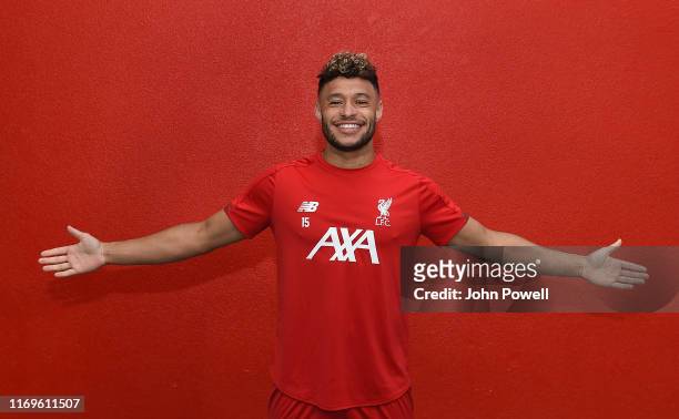 Alex Oxlade-Chamberlain signs a new contract at Melwood Training Ground on August 22, 2019 in Liverpool, England.
