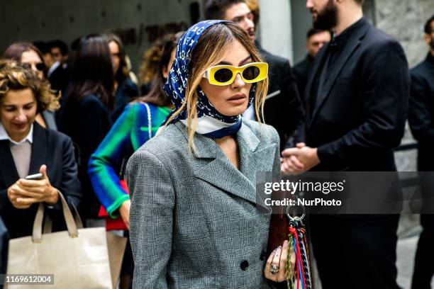 Guest outside Armani at Milan Fashion Week, Milano, Italy, on September 19 2019, Italy