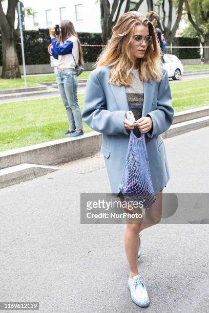 Guest outside Armani at Milan Fashion Week, Milano, Italy, on September 19 2019, Italy