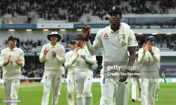 England bowler Jofra Archer leaves the field holding the ball after claiming 6 wickets during day one of the 3rd Ashes Test match between England and...