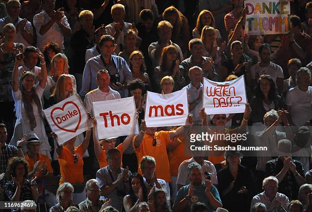 Members of the audience display banners during the "Wetten dass..?" Summer Edition presented by Thomas Gottschalk on June 18, 2011 in Palma de...