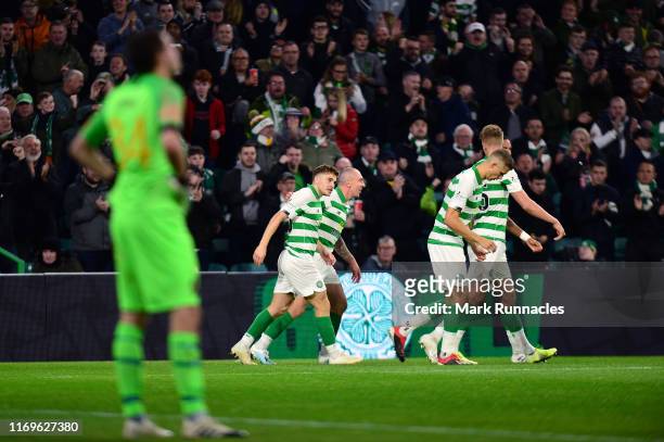 Celtic celebrate with James Forrest after he scored the opening goal during the UEFA Europa League Play Off First Leg match between Celtic and AIK at...