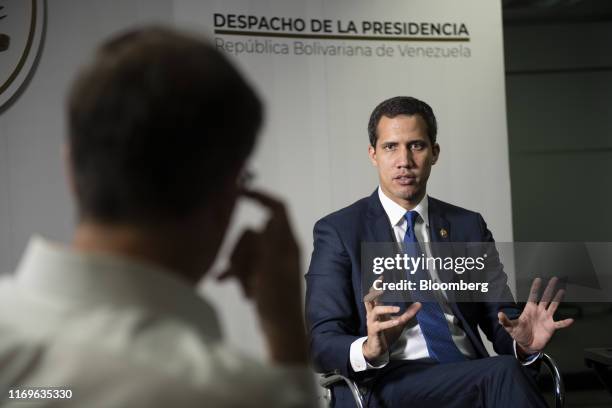 Juan Guaido, president of the National Assembly who swore himself in as the leader of Venezuela, speaks during an interview at his office in Caracas,...