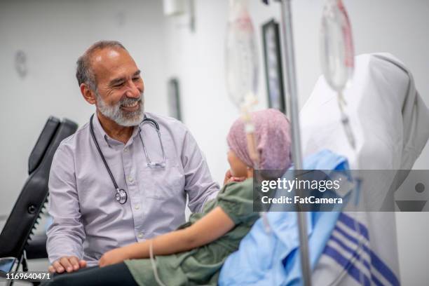 cancer patient in oncology unit - childhood cancer stock pictures, royalty-free photos & images