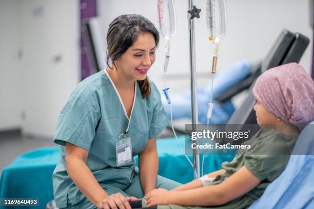 cancer patient in oncology unit - childhood cancer stock pictures, royalty-free photos & images