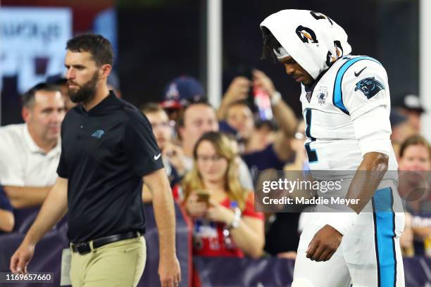 Cam Newton of the Carolina Panthers exits the field during the preseason game between the Carolina Panthers and the New England Patriots at Gillette...