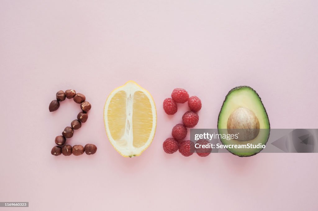 2020 made from healthy food on pastel pink  background, Healhty New year resolution diet and lifestyle