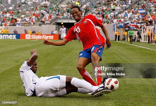 Osman Chavez of Honduras blocks the shot of Junior Diaz of Costa Rica during the 2011 Gold Cup Quarterfinals on June 18, 2011 at the New Meadowlands...