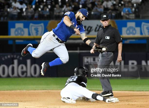 Leury Garcia of the Chicago White Sox steals second base as Rougned Odor of the Texas Rangers takes a high throw during the fourth inning at...