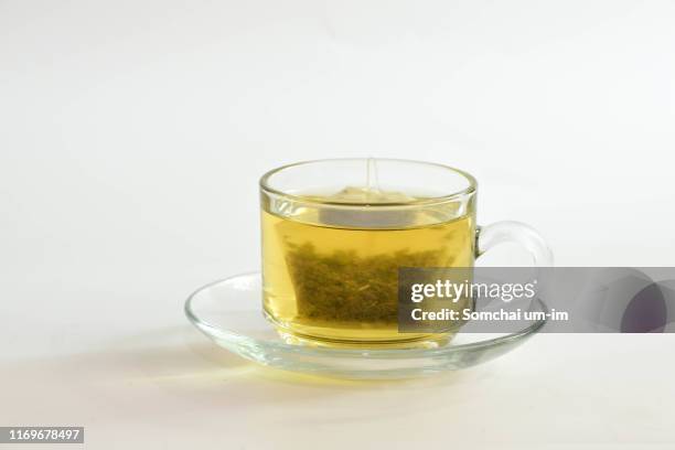 tea and green tea in bag - herbal tea bag stock pictures, royalty-free photos & images