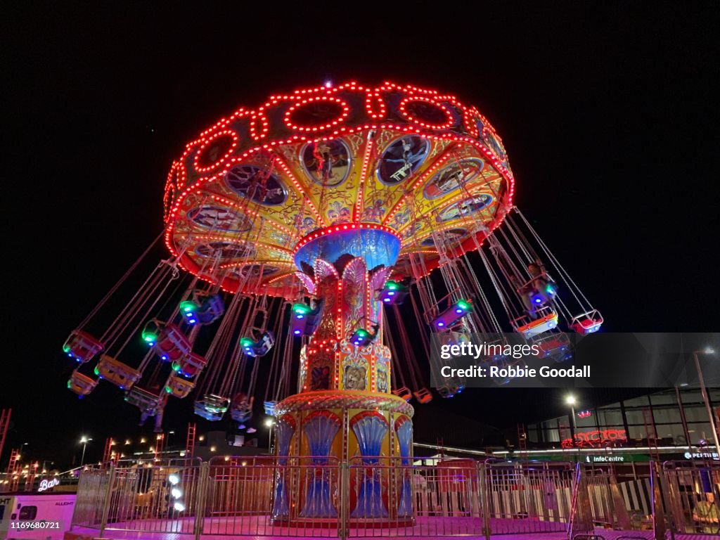 People on an illuminated Carousel