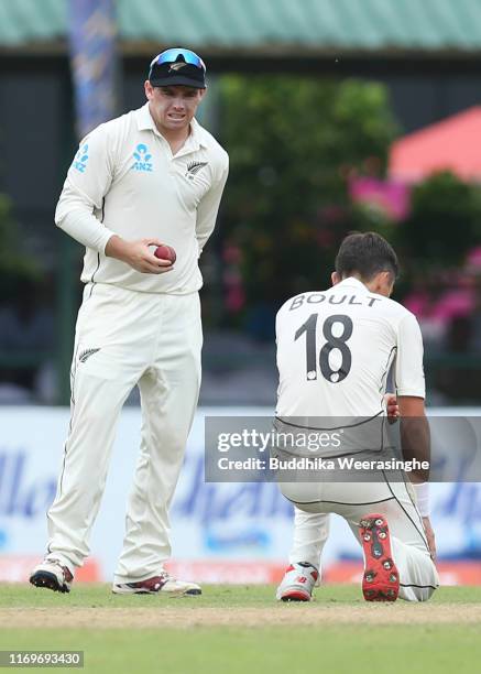 Tom Latham of New Zealand and reacts after a dropped catch by Trent Boult during the day two of the Second Test match between Sri Lanka and New...