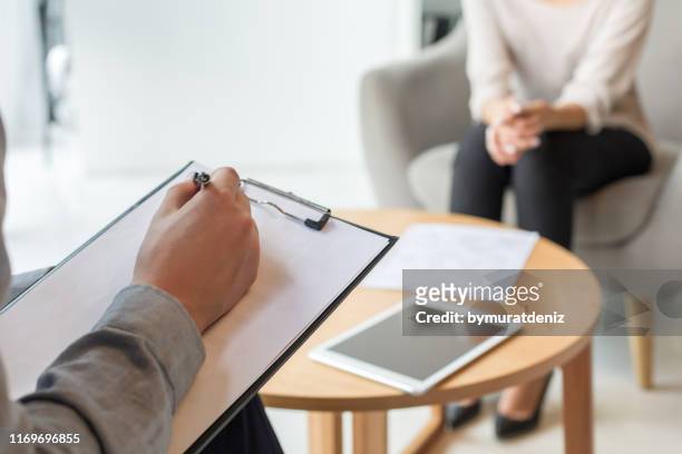 psychologist understanding problems of a woman patient - mental health professional stock pictures, royalty-free photos & images