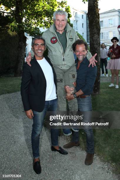 Actor Stephane de Groodt, director Claude Lelouch and actor Ary Abittan attend the Photocall of the movie "La Vertu des Imponderables" during the...