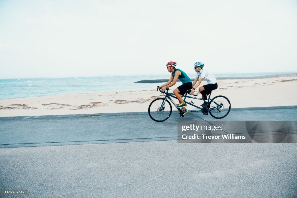 Blind triathlete and his guide training on their tandem bicycle