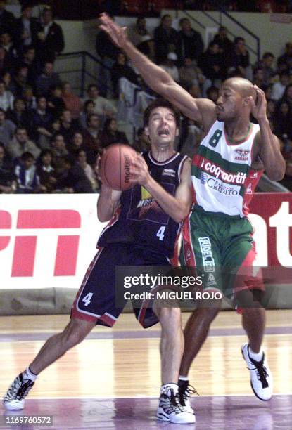 Pegolo Marco, Brazilian player of Franca fights for a ball with Uruguayan player of Aguada Davis Sterling 28 October 2000 in Montevideo, Uruguay,...