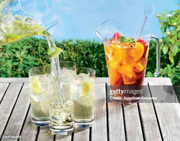 summer drinks on table outside - jug stock pictures, royalty-free photos & images